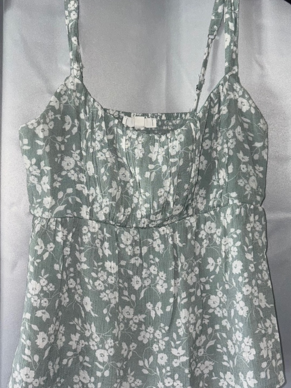 Green and white flowered tank